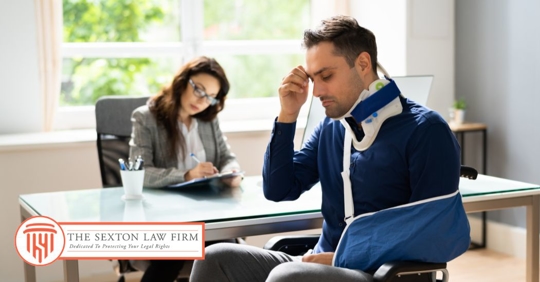 injured employee talking to a lawyer