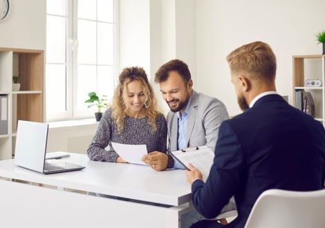 man and woman reviewing estate plan with lawyer